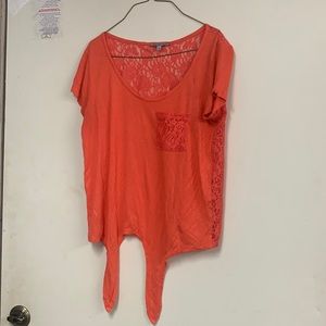 Coral colored top. See thru floral back
